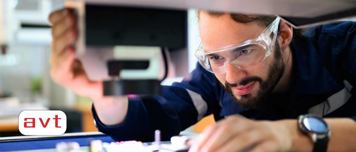 Quality control engineer specialist checking and inspecting circuit board at electronic factory